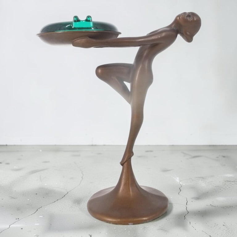 Art Deco School Bronze Figural Nude Smoke Stand: Frankart Style Art Deco School Bronze Figural Nude Ashtray Smoke Stand. Similar to Frankart. Glass ashtray. Unsigned. Measures 8" H x 6-3/4". Condition: Good condition. Estimate 100 - 300 Domestic