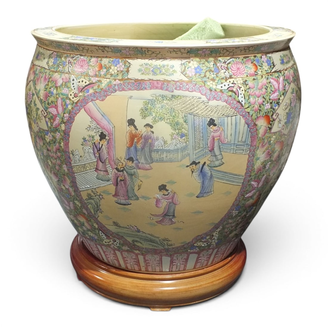 Vintage Large Chinese Famille Rose Jardiniere: Vintage Large Chinese Famille Rose Jardiniere with Wood Stand. Decorated with a floral motif with court scene vignettes. Measures 25" H x 28-1/2" W. Condition: Good condition. Estimate 400 - 800 Domes