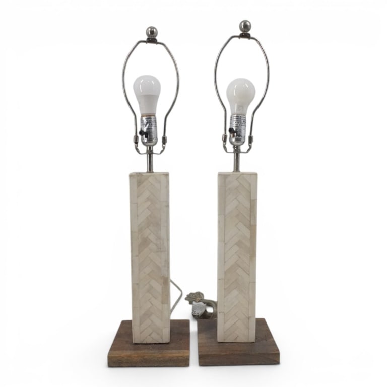 Pair of West Elm Lamps: Pair of West Elm Tessellated Bone Lamps. Measures 27-1/2" x 6-1/2". Condition: Good condition. Estimate 100 - 400 Domestic shipping Third party