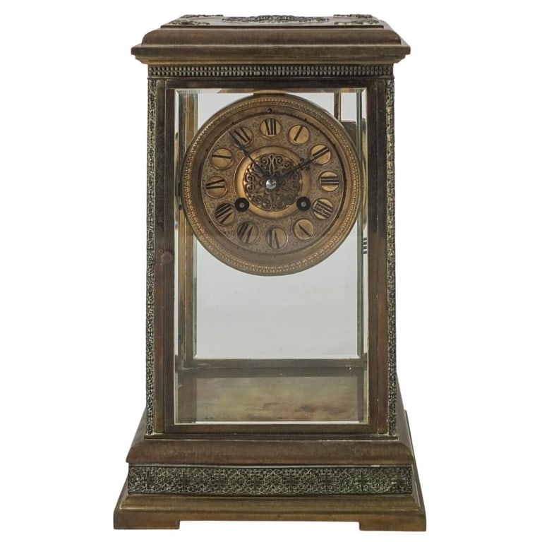 19th C. French Bronze Mantle Clock: 19th Century French Bronze Mantle Clock. Key and pendulum to accompany the lot. Marked "Medaille D’Argent, P. Marti and Co, Made in France" on the movement. Measures 11-3/4" x 7" x 5-5/8". Please