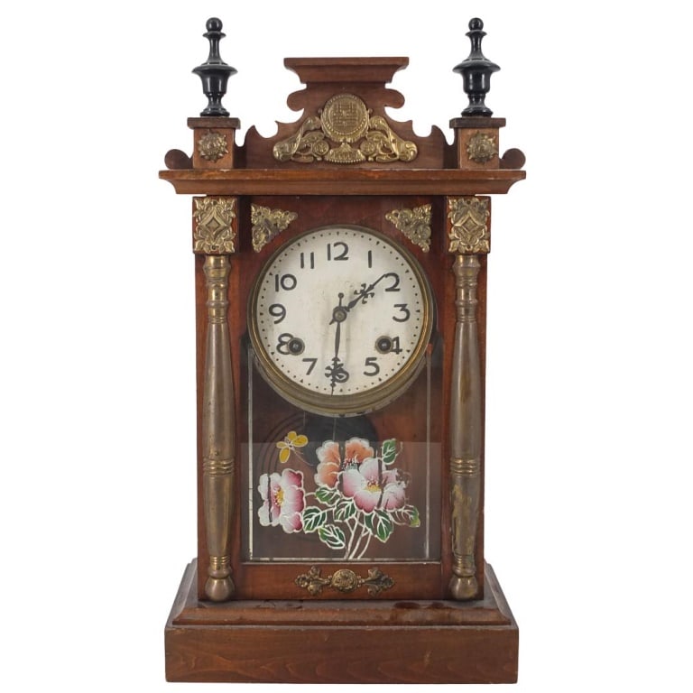 Antique Continental School Mantle Clock: Antique Continental School Wooden Mantle Clock with Brass Mounts and Reverse Painted Glass Cover. Key and pendulum to accompany the lot. Measures 20-3/4" x 11" x 5". Please note; we do not guarantee