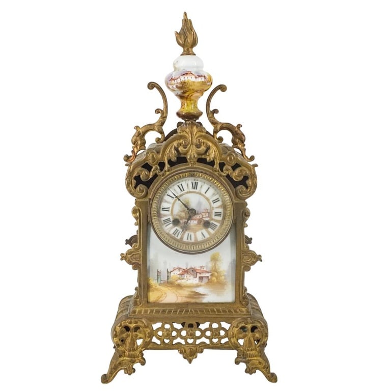 19th C. French Bronze Mantle Clock: 19th Century French Gilt Bronze Mantle Clock with and Hand Painted Porcelain Porcelain Panel. Measures 18-1/4" x 9" x 4-1/2". Please note; we do not guarantee the working condition of clocks.
