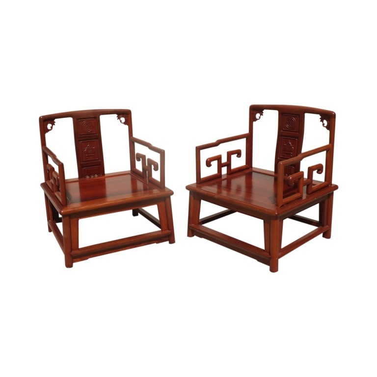 Pair of Chinese Low Armchairs: Pair of imperial Chinese carved Huanghuali hardwood low armchairs. Measures 30-1/2" x 25-3/4" x 13-1/2". Condition: One arm on one chair needs to be reset. . Estimate 50 - 150 Domestic shipping Third