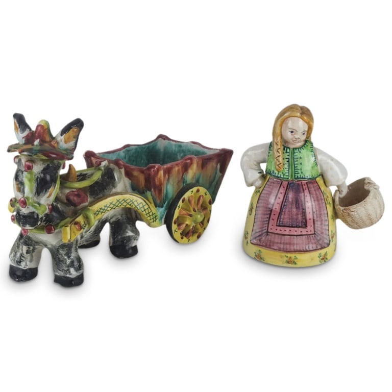 Grouping of Italian Porcelain Figurines: Grouping of Two Vintage Italian Porcelain Figurines. Both are marked on the base. Lot includes Majolica Donkey Carriage together with a Girl holding a Basket. Carriage Measures 6-5/8" x 11 x 5". Girl 