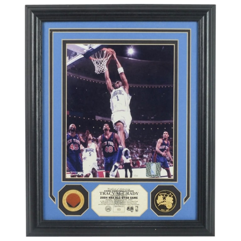 Tracy McGrady 2004 NBA All Star Game Photo: Tracy McGrady 2004 NBA All Star Game Photo Memorabilia by Photofile. COA attached en verso. Sight measures 9-1/8" x 7-1/4". Frame measures 16-1/8" x 13-1/8". Condition: Good condition. Estimate 50 - 1