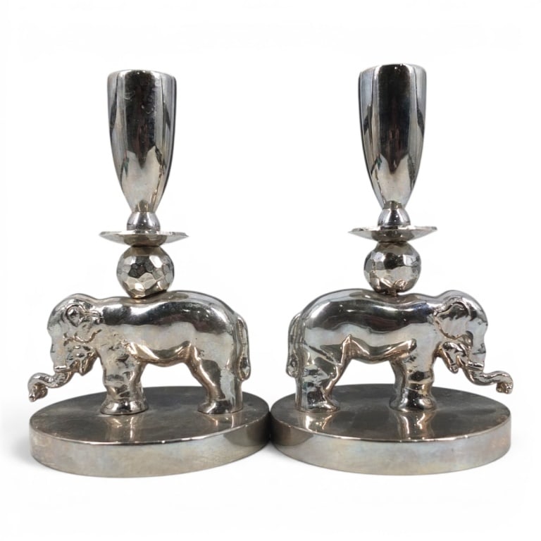 Pr Palmer Smith Silver Tone Elephant Candlesticks: Pair Vintage Palmer Smith Silver Tone Elephant Candlesticks. Marked on bottom Palmer Smith 477 B. Measures 6-1/4" H. Condition: Good condition consistent with age and use. Estimate 100 - 200 Domestic