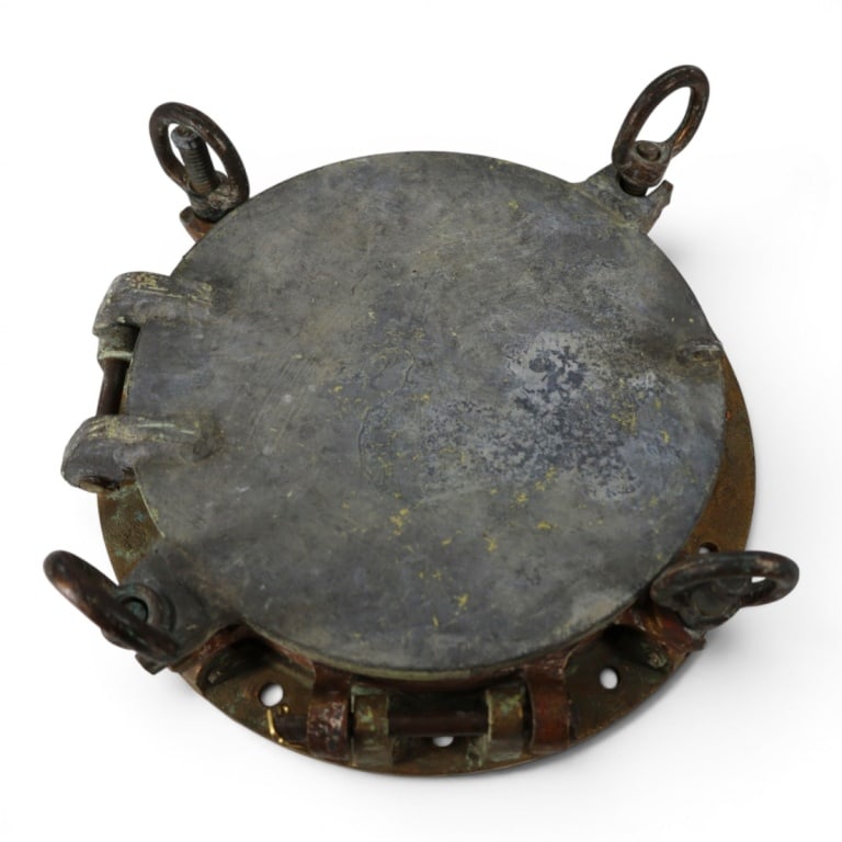 Antique Brass Porthole with Heavy Storm Cover: Vintage Brass Porthole with Heavy Storm Cover. All four threaded fasteners are intact and functional as well as the hinge and storm cover. Glass is in very good condition with only small flaws. Measur