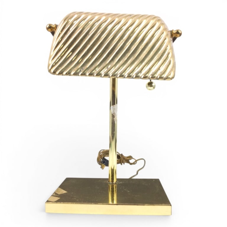Kovacs Vintage Brass Bankers Lamp: Chapman, Vintage Brass Bankers Desk Lamp. Heavy weight, ribbed shade. Signed KOVACS on underside. Measures 15" H x 10" W x 8" D. Condition: Remnants of tape, stickers, some oxidation, overall good