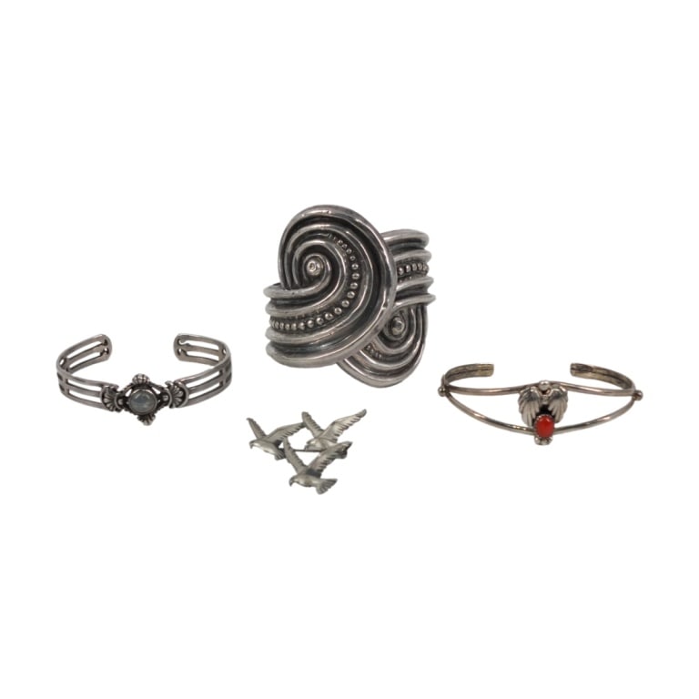 4 Pc Sterling Southwest Jewelry Group: 4 Piece Sterling Southwest Jewelry Group. Includes a silver and coral bracelet by Lester Ortiz, a Taxco Mexico silver hinged cuff bracelet, a silver and moonstone bracelet and a small brooch