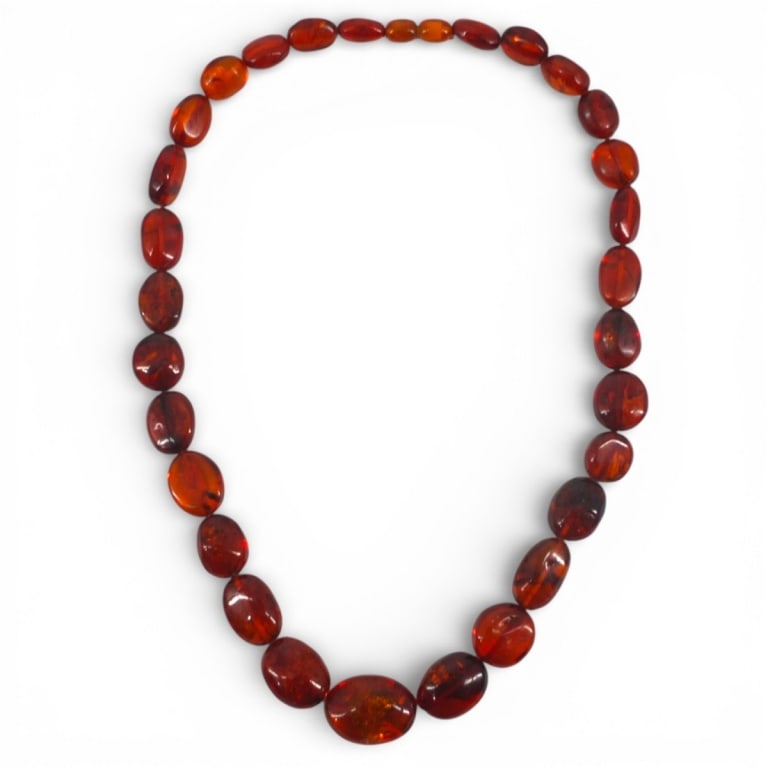 Vintage Baltic Amber Bead Necklace: Vintage Baltic Amber Graduated Bead Necklace. Unsigned. Measures 21-1/2" L, beads 25mm - 6mm. Weighs approx. 47 grams. Condition: Good condition. Estimate 100 - 300 Domestic shipping Third Party