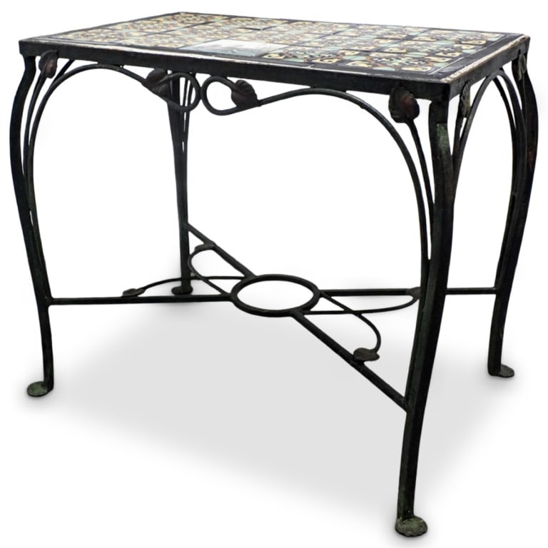 Circa 1920s California School Tile Top Side Table: Circa 1920s California School Tile Top Wrought Iron Side Table with Plat Feet. Unmarked. Measures 21-1/2" x 25-1/2" x 17-1/4". Condition: Oxidation and rubbing to the iron base otherwise good