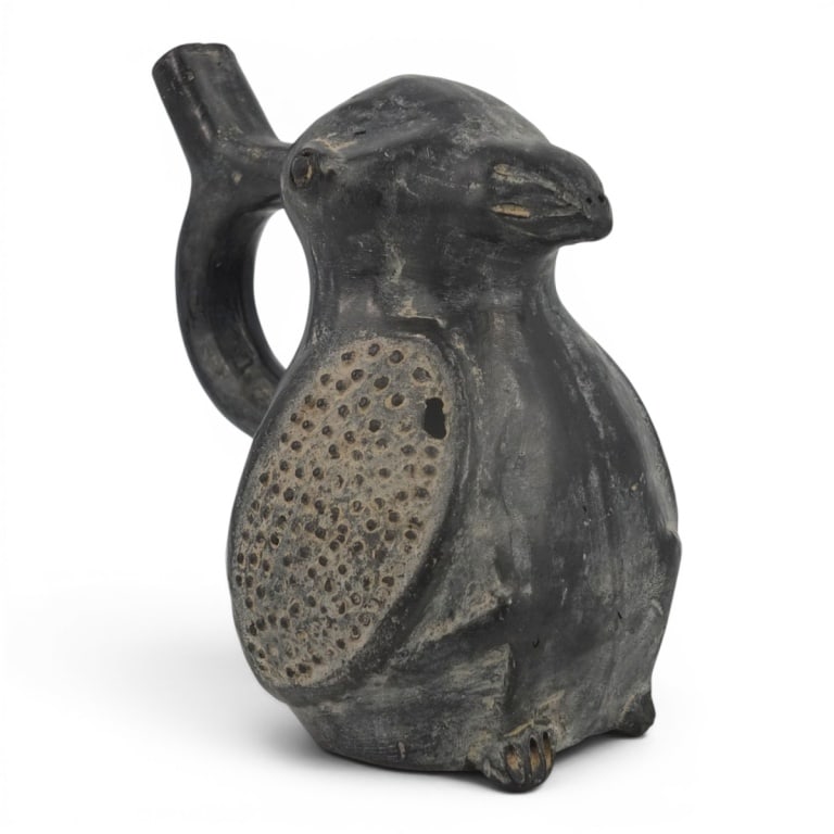 Pre-Columbian Chimu Black Pottery Whistling Vessel: Pre-Columbian Chimu Black Pottery Whistling Vessel. Unsigned. Measures 6" H. Condition: Small hole in side, wear consistent with age and use. Estimate 100 - 300 Domestic shipping Third Party
