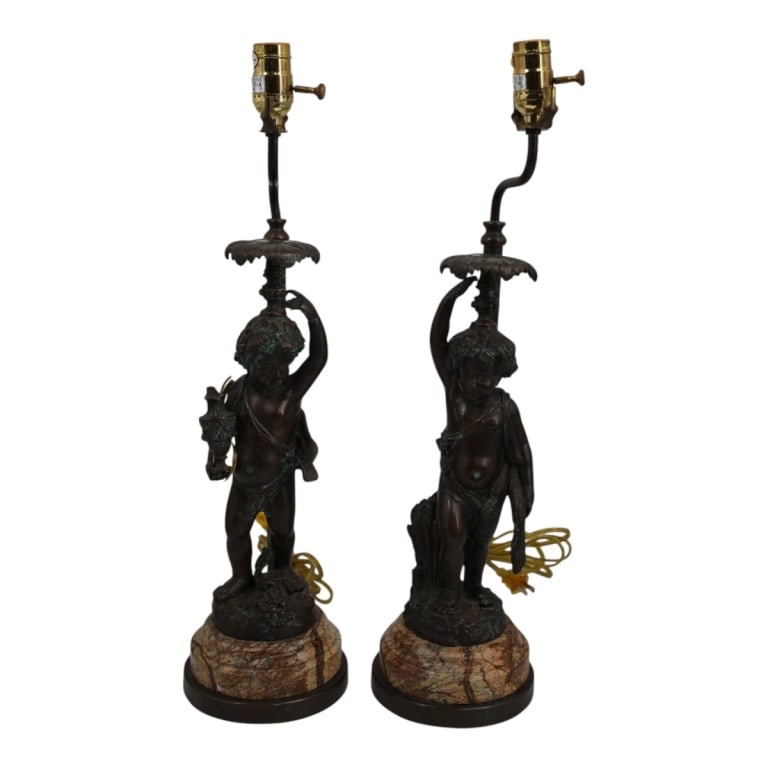 Antique Moreau Style Bronze Figural Putti Lamps: Antique French Moreau Style Bronze Figural Putti Lamps on Marble Bases. Unsigned. Measures 23" H overall including hardware, the bronze and marble measures 15" H, 7-1/4" W at base. Condition: Good ant