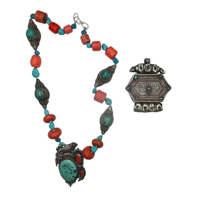 2 Pcs Vintage Tibetan Turquoise Tribal Jewelry: 2 Pcs Vintage Tibetan Turquoise Tribal Jewelry. Includes: Statement necklace with turquoise and coral or carnelian beads. Measures 15" including pendant. White metal amulet/ghau box with turquoise, 3-