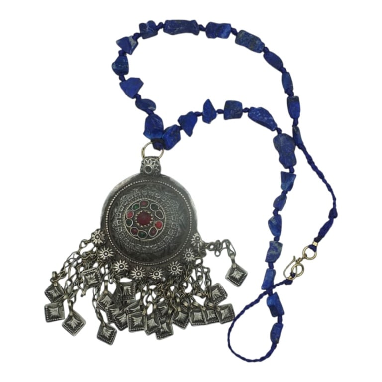 Vintage Afghan Lapis Tribal Statement Necklace: Vintage Afghan Lapis Bead Tribal Statement Necklace. The metal pendant set with tiny gem cabochons. Measures 17" including pendant. Condition: Good condition. Estimate 60 - 120 Domestic shipping Third