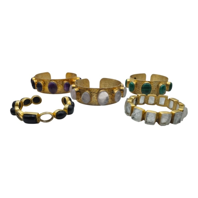 5 Plated Brass & Gemstone Cuff Bracelets: 5 Plated Brass & Gemstone Cuff Bracelets. Includes Malachite, crystal and onyx. The 3 larger are 1" thick. Condition: 1 with missing stones, the rest in good condition. Estimate 100 - 150 Domestic shi