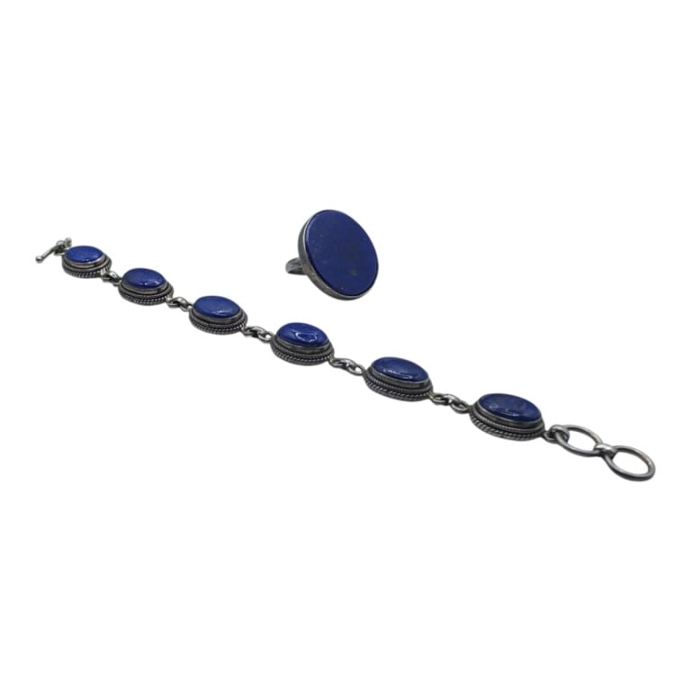 Sterling Silver & Lapis Ring & Bracelet: Sterling Silver & Lapis Lazuli Flat Round Ring. Stamped 925. Size 8. Measures 1" diameter. Weighs approx. 9.74 grams. Sterling & Lapis cabochon bracelet. Stamped 925. Measures 7-1/2" and weighs approx