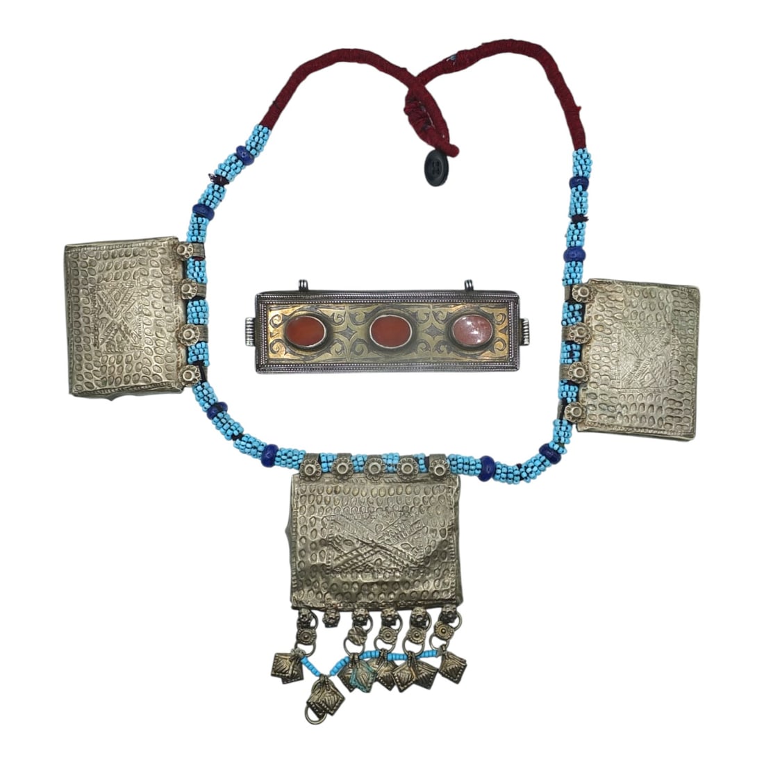 2 Pieces Vintage Afghan Tribal Jewelry: Includes: Vintage Afghan Kuchi Prayer Box Necklace on braided bead cord. Measures 15" including box. Antique Turkmen silver and parcel-gilt cuff or bracelet with carnelian cabochons, no band. Measures