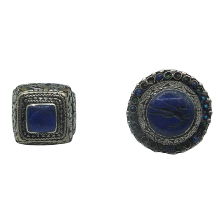 2 Vintage Afghan Tribal Silver and Lapis Rings: 2 Vintage Afghan Tribal Silver and Lapis Rings. Size 8. Condition: Some tiny cabochons missing from one or in Good condition. Estimate 100 - 200 Domestic shipping Third Party