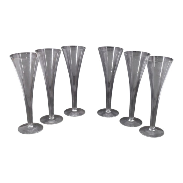 (6) Tiffany & Co Trumpet Champagne Flutes: (6) Tiffany & Co Trumpet Champagne Flutes. Signed. Measures 9". Condition: 1 with tiny flea bite on rim, no other chips or cracks. Estimate 120 - 240 Domestic shipping Third Party