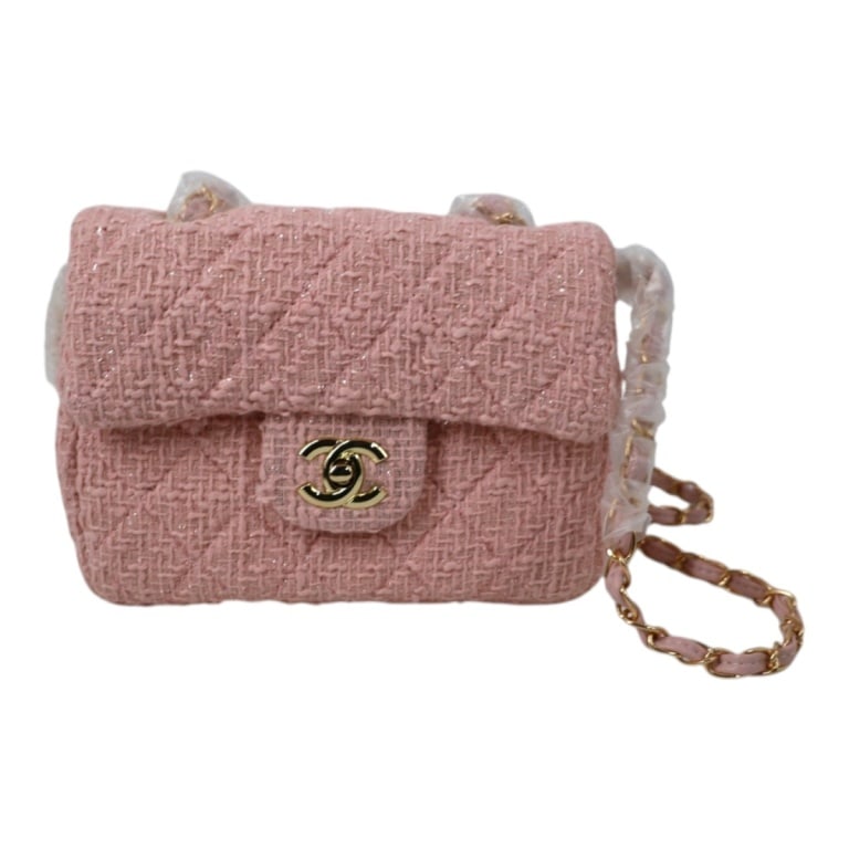 Replica Chanel Mini Classic Flap Bag Pink Tweed: Replica Chanel Mini Classic Flap Bag Pink Tweed. With box and dustbag. Gold tone hardware, shoulder strap. Measures 5-1/2" x 7-1/2" x 3". Condition: Good unused condition. Estimate 150 - 350 Domestic 