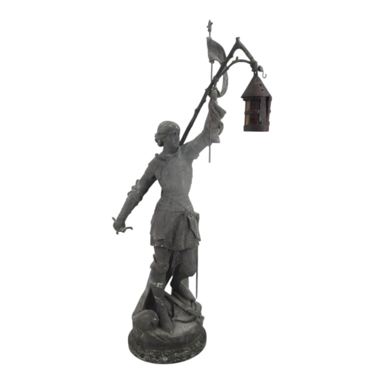 Vintage French Spelter "Joan of Arc" Standing Lamp: Vintage French Spelter "Joan of Arc" Standing Lamp. Leaded glass panels in lamp. Modeled after Joseph Berthoz "Sainte Jeanne d'Arc au Combat". Marked Made In France. Measures 34" H x 14" x 13".