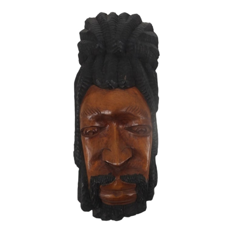 Hand-Carved Jamaican Rastafarian Wood Bust: Hand-Carved Jamaican Folk Art Rastafarian Wood Bust Wall Hanging. Unsigned. Measures 18" H x 7" W. Condition: Good condition. Estimate 50 - 100 Domestic shipping Third Party