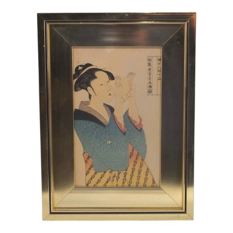1960's Japanese Woodblock "Woman Reading a Letter": 1960's Decorative Japanese Woodblock "Woman Reading a Letter". Originally created by Kitagawa Utamaro. Framed under glass. Measures 10-1/2" x 6-1/2", frame 15-1/2" x 11-1/2". Condition: Light toning, 