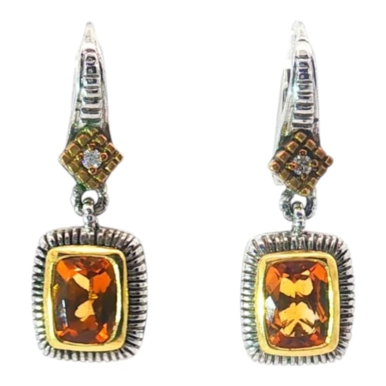 Pair of Judith Ripka Sterling / 18K Earrings: Pair of Judith Ripka Sterling Silver and 18 Karat Yellow Gold Accented Citrine Drop Earrings. Approx. 1.00 carat Cushion-cut citrine. Condition: Good condition. Estimate 300 - 500 Domestic shipping