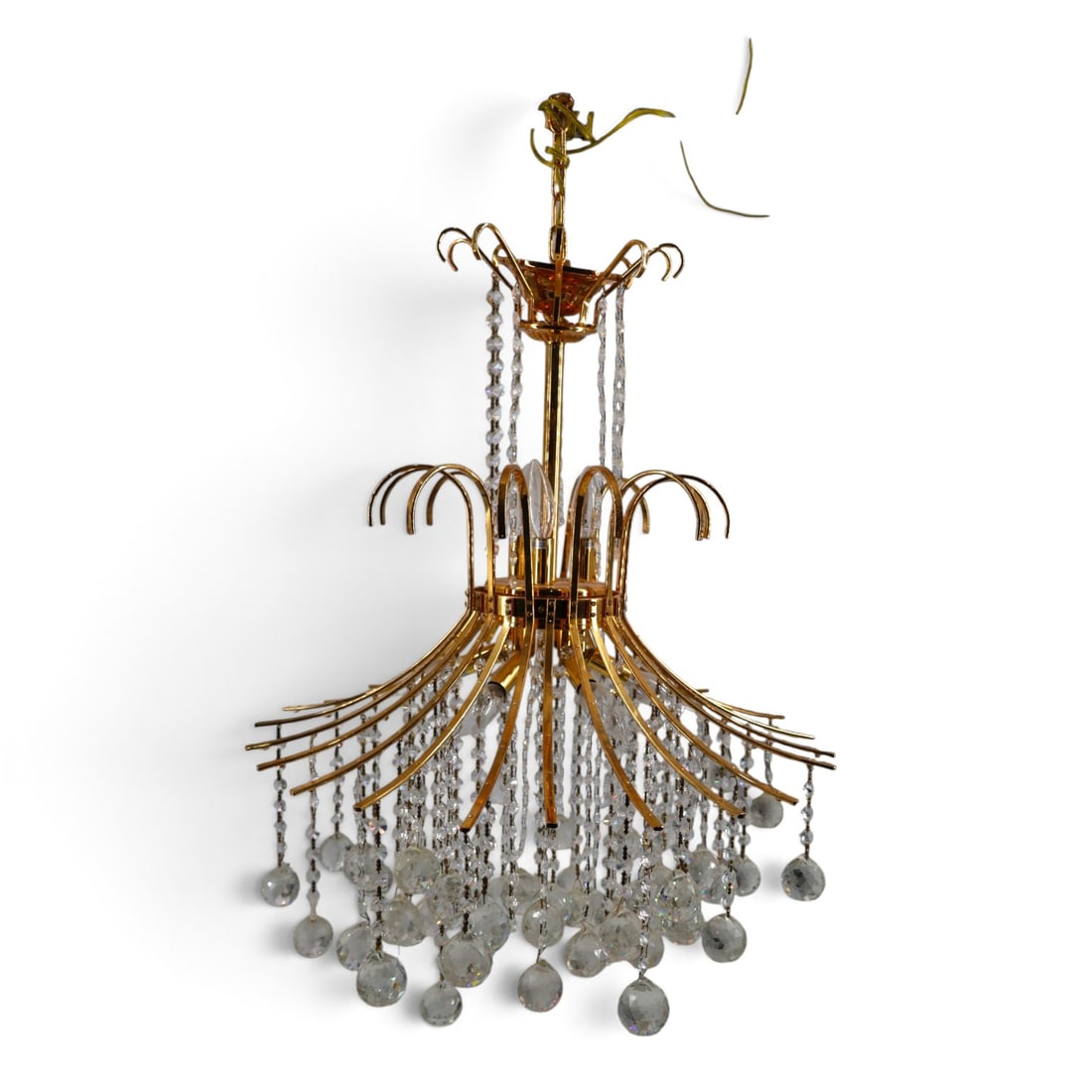 Hollywood Regency-style Gilt Metal Chandelier: Hollywood Regency-style Gilt Metal and Crystal Chandelier. Unsigned. Measures 22" H x 23" W, crystal drops approx. 9" L. Condition: Overall good condition in need of restoration. In need of cleaning a