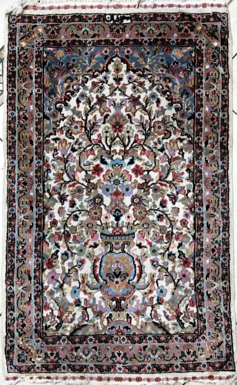 Tapis D'Orient Isfahan Wool & Silk Persian Rug: Tapis D'Orient Isfahan Design Hand-knotted . Features an intricate floral vase and arch motif. Label affixed to backside. Measures 50" x 30". Condition: Loss to fringe or in good pre-owned condition. 