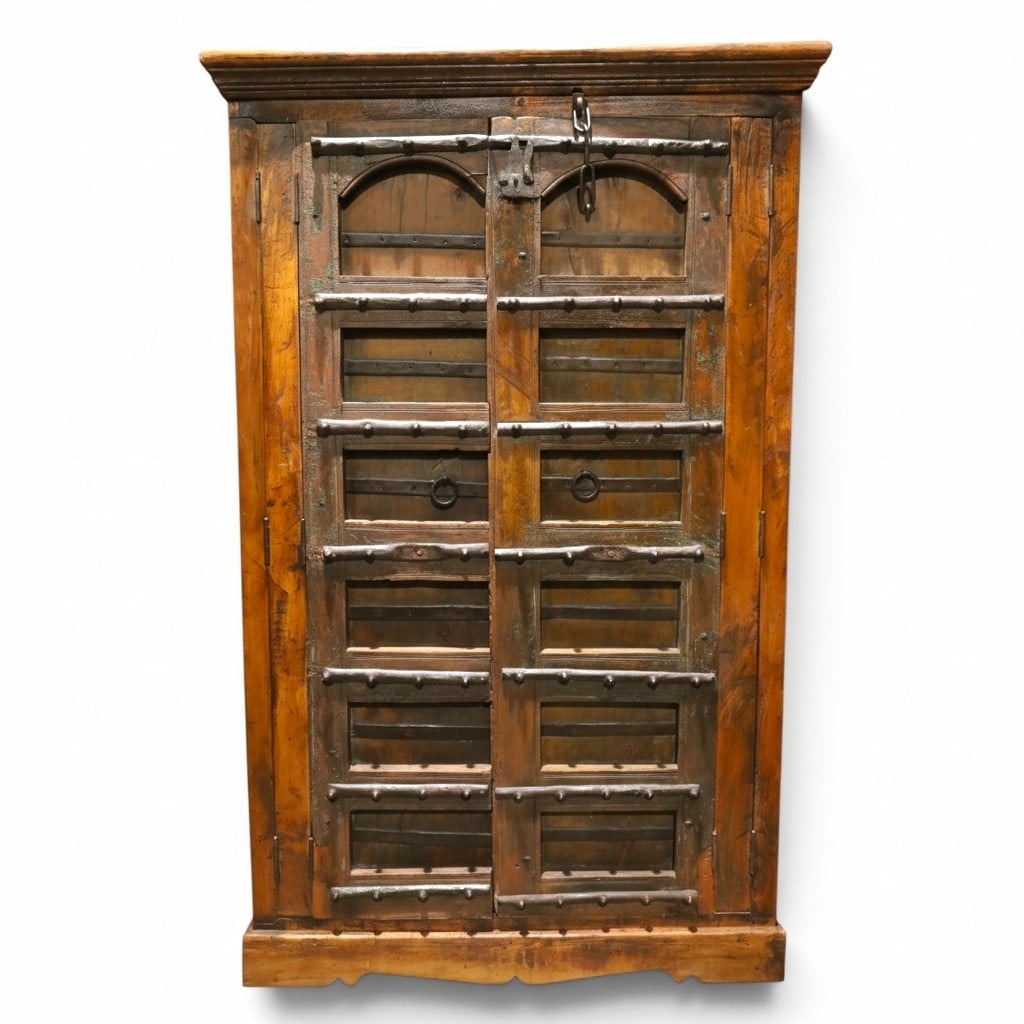 Antique Mughal Hand Carved Cabinet: Antique Mughal Hand Carved Cabinet with Repurposed Temple Doors with Iron Accents. Measures 83-1/4" H x 52" W x 25-1/4" D. Condition: Good condition. Estimate 400 - 800 Domestic shipping Third party