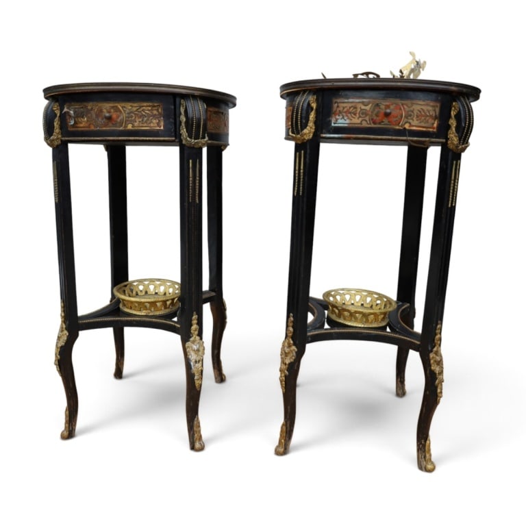 Pr French Louis XVI-style Gueridon Side Tables: Pair Antique French Louis XVI-style Ebonized Gueridon Side Tables. The tops feature intricate brass-inlaid Boulle marquetry work. Integrated lower shelf with woven brass basket detail and ornate gilde