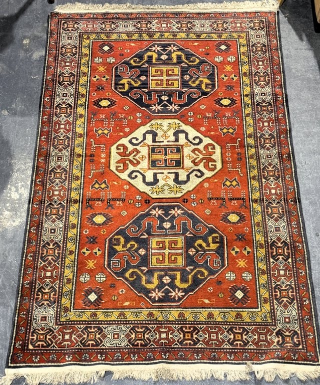 Semi-Antique Derbent Kazak Caucasian Wool Rug: Semi-Antique Derbent Kazak Caucasian Wool Rug. Old faded label affixed to backside. Measures 81" x 51". Condition: Would benefit from cleaning or in good pre-owned condition. Some running. Estimate