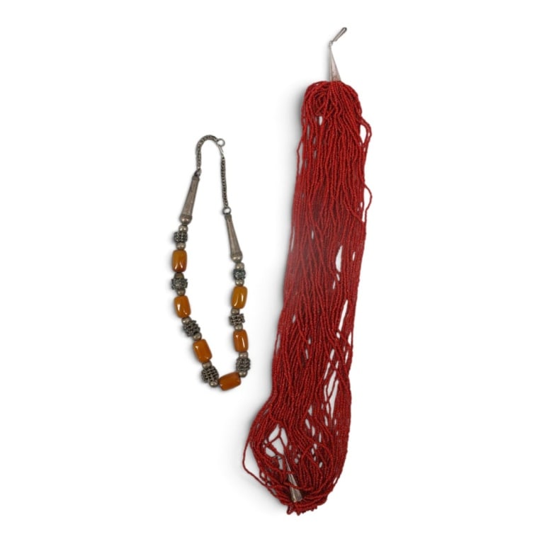 2 Vintage BOHO-style Bead Necklaces: 2 Vintage BOHO-style Bead Necklaces. A multi-strand red seed bead (coral?) necklace with silver-tone end caps, 22" L. A ethnic beaded necklace featuring barrel resin beads with silver-tone spacers,