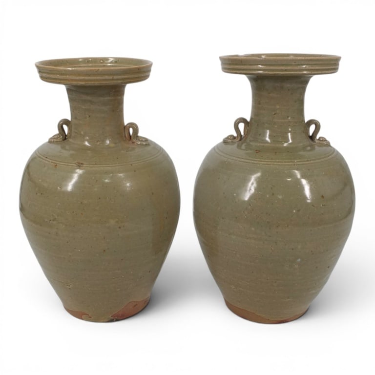 Pair Vintage SE Asian Celadon Stoneware Vases: Pair Vintage Southeast Asian Celadon Stoneware (Yu ware) Vases. Unsigned. Measure 12" H & 12-3/4" H, Condition: Taller with 2 chips to rim or in good condition consistent with age and use. Estimate 15