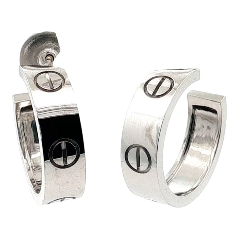 Pair of Cartier 18K White Earrings: Pair of Ladies Cartier 18 Karat White Gold Love Hoop Earrings. Stamped. Please note: Alternative payment may be required for this jewelry lot. Condition: Good condition. Estimate 1500 - 2500 Domestic 
