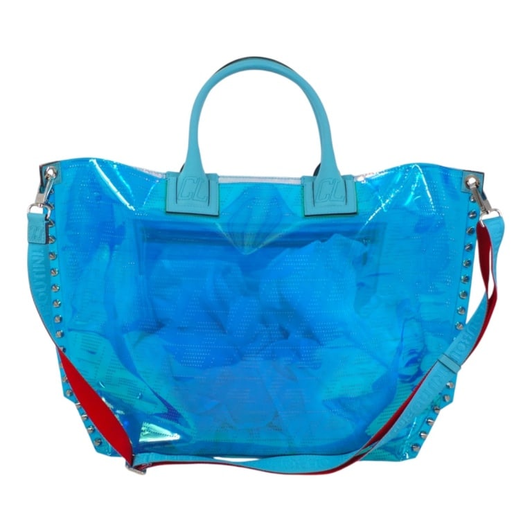 Christian Louboutin Cabalou Flash Blue Tote Bag: Christian Louboutin Techno Perforated TPU Calfskin Cabalou Tote Bag Flash Blue. Crafted of iridescent blue TPU, blue calfskin rolled top handles, an optional adjustable canvas strap, and silver