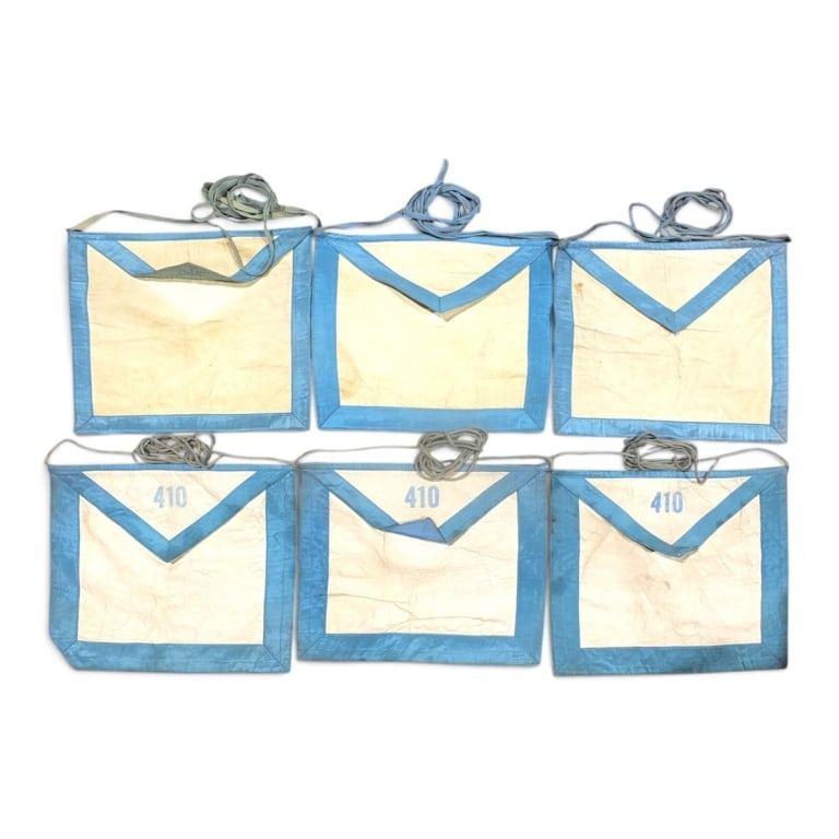 6 Antique Lambskin Masonic Aprons: 6 Antique Lambskin Masonic Aprons. 3 Stamped 410 on flap, 3 blank. Each measures 11" x 13". Condition: Toning, faded, lightly soiled, consistent with age and storage. Antique condition Estimate 100 -