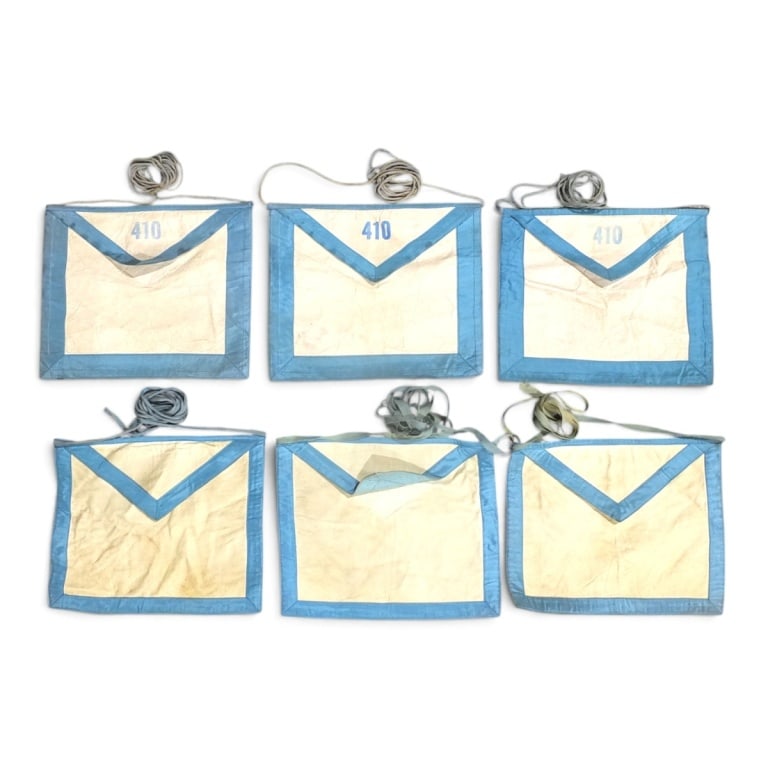 6 Antique Lambskin Masonic Aprons: 6 Antique Lambskin Masonic Aprons. 3 Stamped 410 on flap, 3 blank. Each measures 11" x 13". Condition: Toning, faded, lightly soiled, consistent with age and storage. Antique condition Estimate 100 -