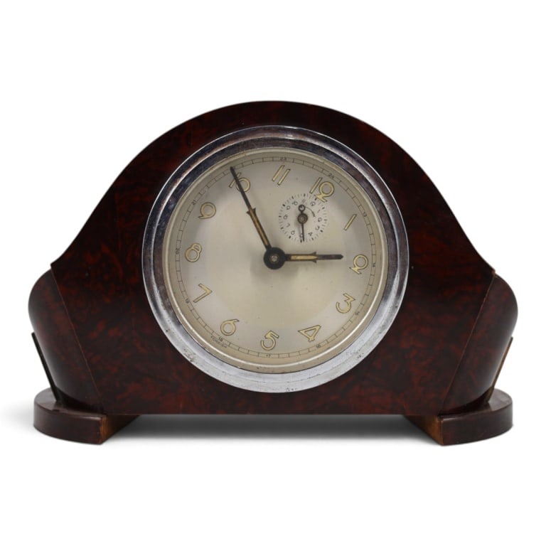 Art Deco Table Clock: Art Deco Wood Table Clock. No visible maker. Measures 5-5/8" x 8-1/2" x 2-1/2". Condition: Wear, rubbing, the face and works are loose in the case. Not running. Please note the gallery does not
