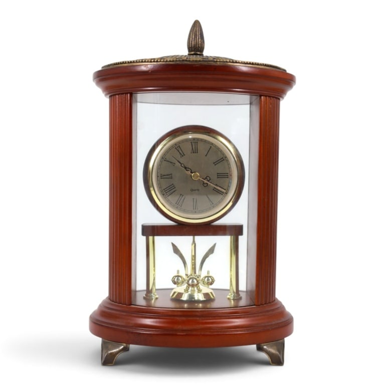 Vintage Bombay Co. Quartz Mantle Clock: Vintage Bombay Company Quartz Mantle Clock. Labeled appropriately. Measures 13" x 8" x 6". Condition: Light wear from age and use. Battery operated and running as of this writing. Please note the