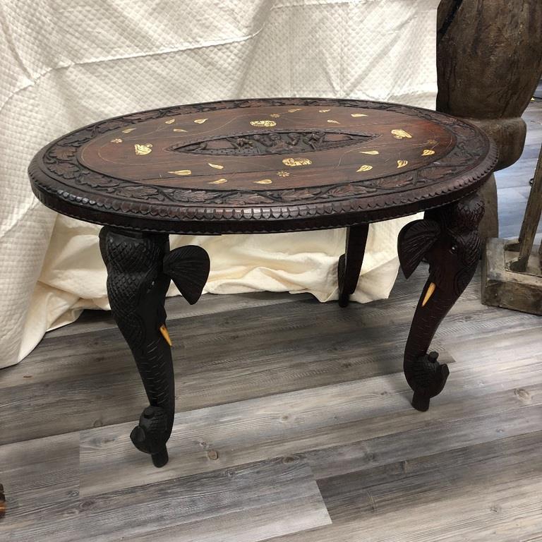 WOODEN ELEPHANT TABLE 24x 36 x 23: WOODEN TABLE WITH ELEPHANT CARVINGS.