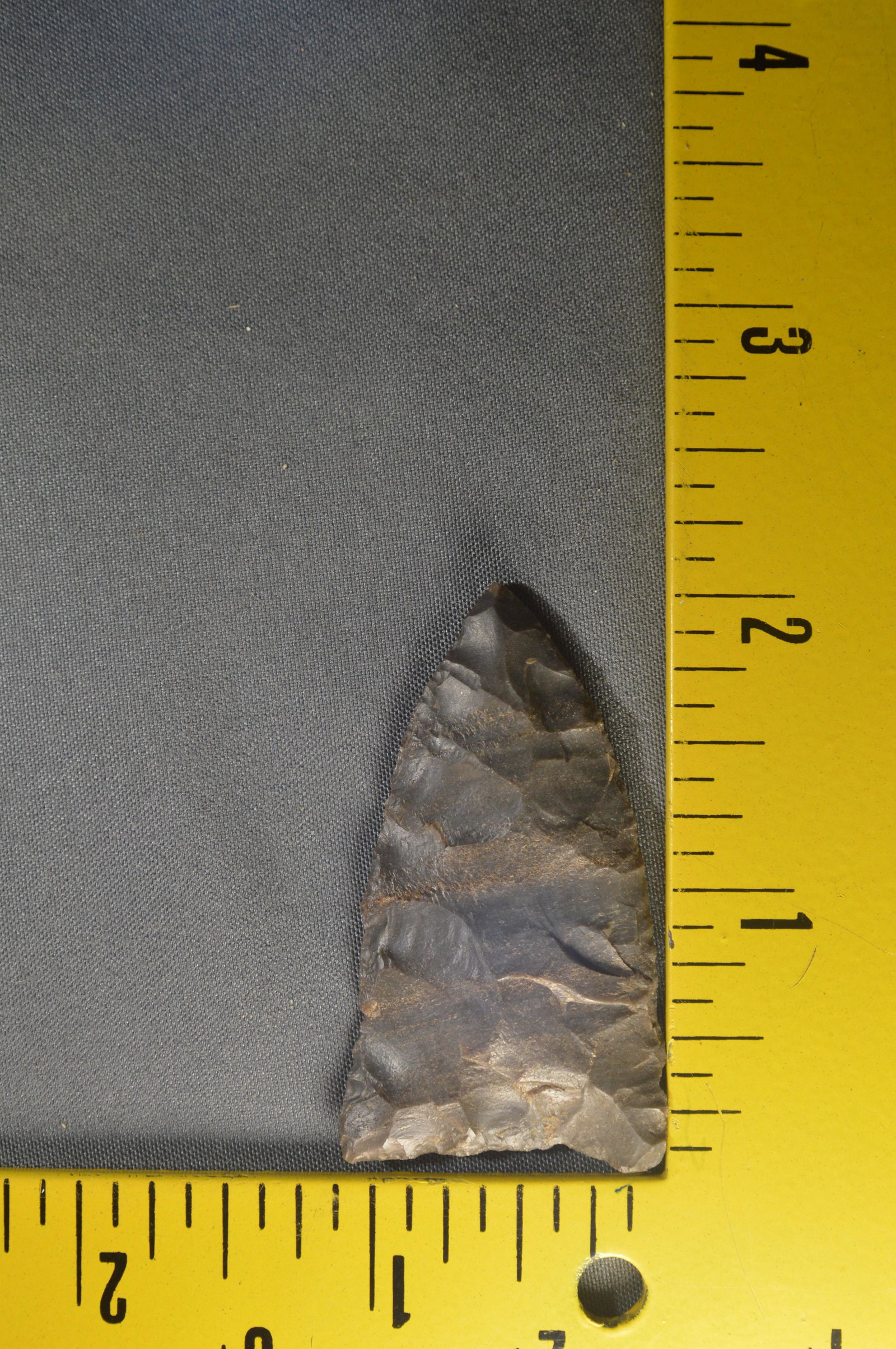 2" Beautiful Early Triangle. Ex; Museum Collection.: 2" Early Triangle Found in Texas. Very well made with long thinning strikes on the base. Made from a Beautiful Banded Chert. 1 1/8" Wide Ex: Ben Winchester Collection.