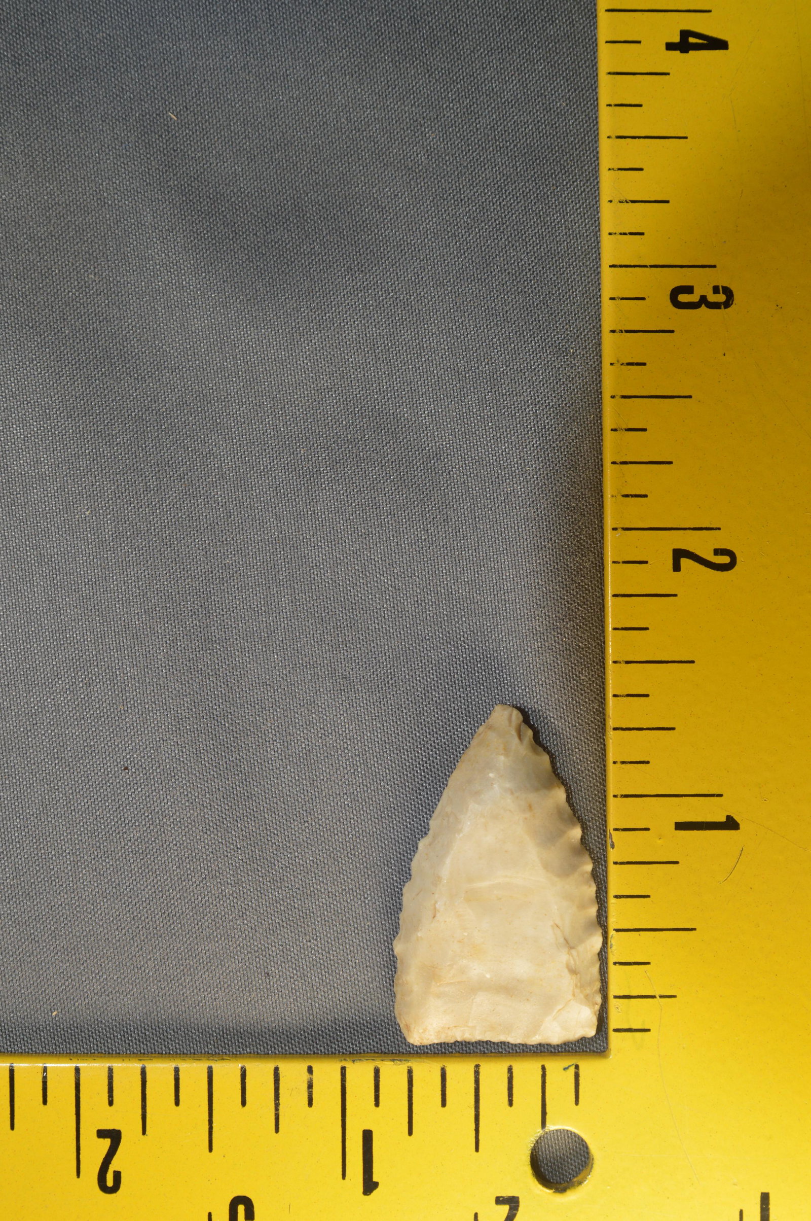 1 5/16" Early Triangle. Ex; Museum Collection.: 1 5/16" Early Triangle Found in Texas. Basal thinning strikes to both sides. 13/16" Wide. Ex: Ben Winchester Collection.