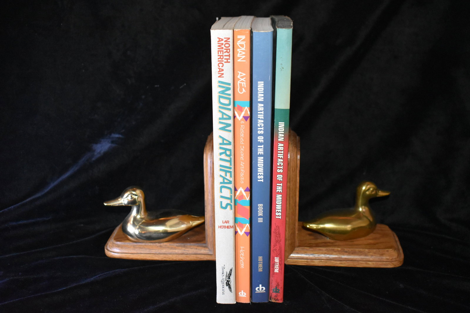 4 Signed Lar Hothem Artifact Books: North American Indian Artifacts by Lar Hothem. 5th Edition in excellent condition; Indian Axes and Related Stone Artifacts by Lar Hothem 1994. Excellent Condition Paperback; Indian Artifacts of the Mi