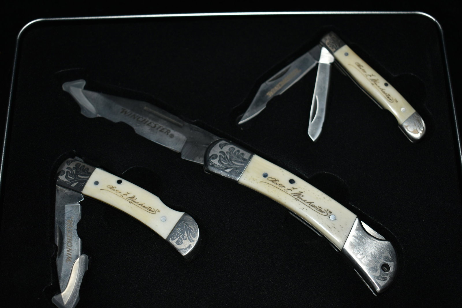 WINCHESTER COLLECTOR KNIFE SET: 200TH COMMEMORATIVE 1810-2010. THREE POCKET KNIVES. LARGEST IS 7.5" TOTAL LENGTH. ONE IS 5.25" AND THE OTHER IS 5" TOTAL LENGTH. The knives in this collector set appear to have never been removed from