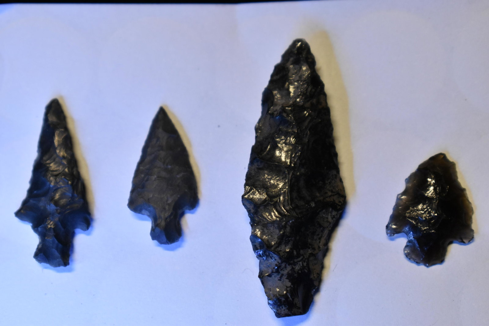 4 Authentic Obsidian Arrowheads: 4 Authentic Obsidian Arrowheads found or acquired by Teddy Chapman. Teddy went west and found or purchased these at some point in his life. We don't know obsidian points that well but can guarantee th