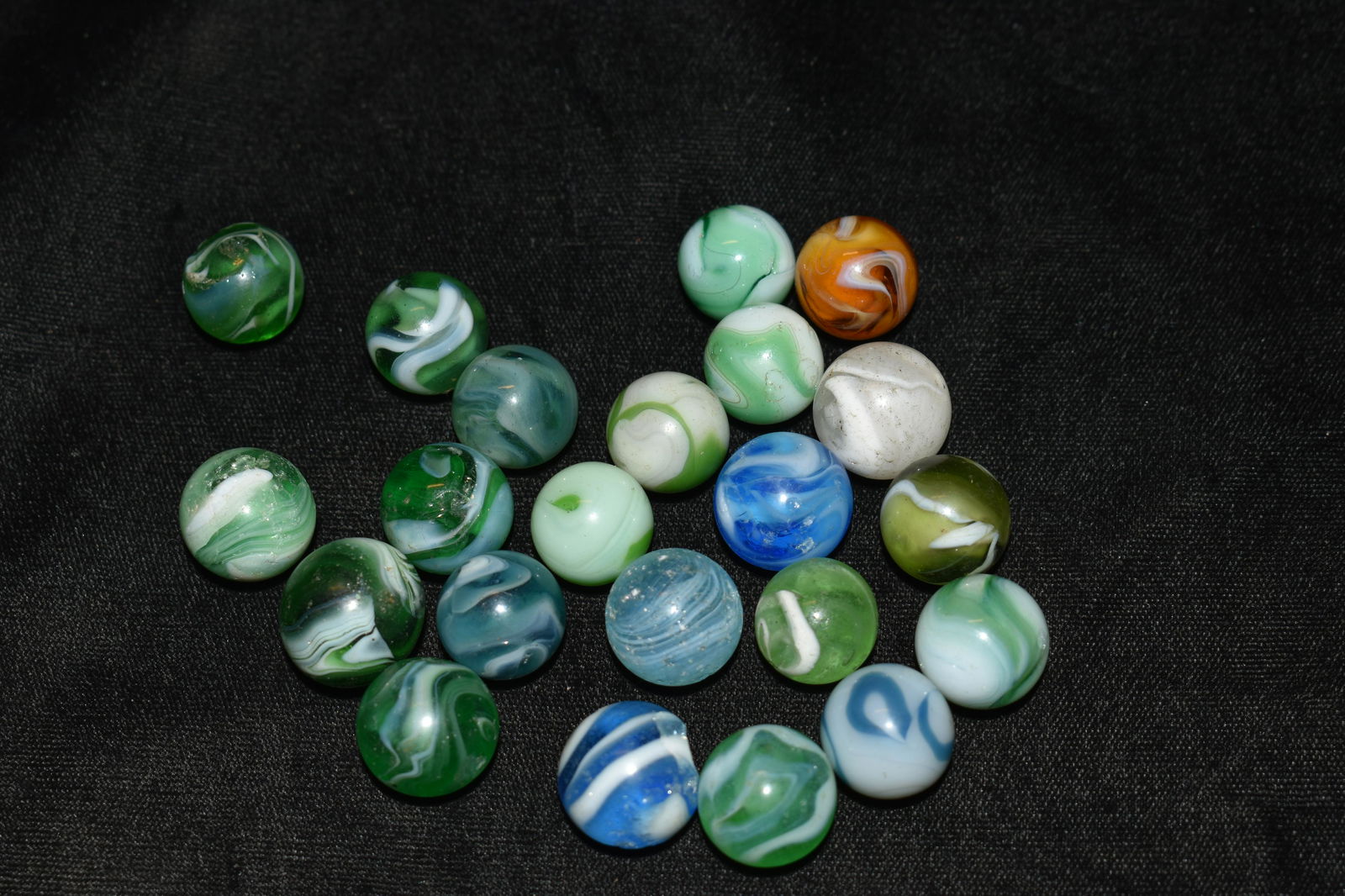 Group of 22 1950's Champion Marbles: Group of 22 1950's Champion Marbles. Many have use wear from play time in their era. 5/8" to a hair over 5/8"