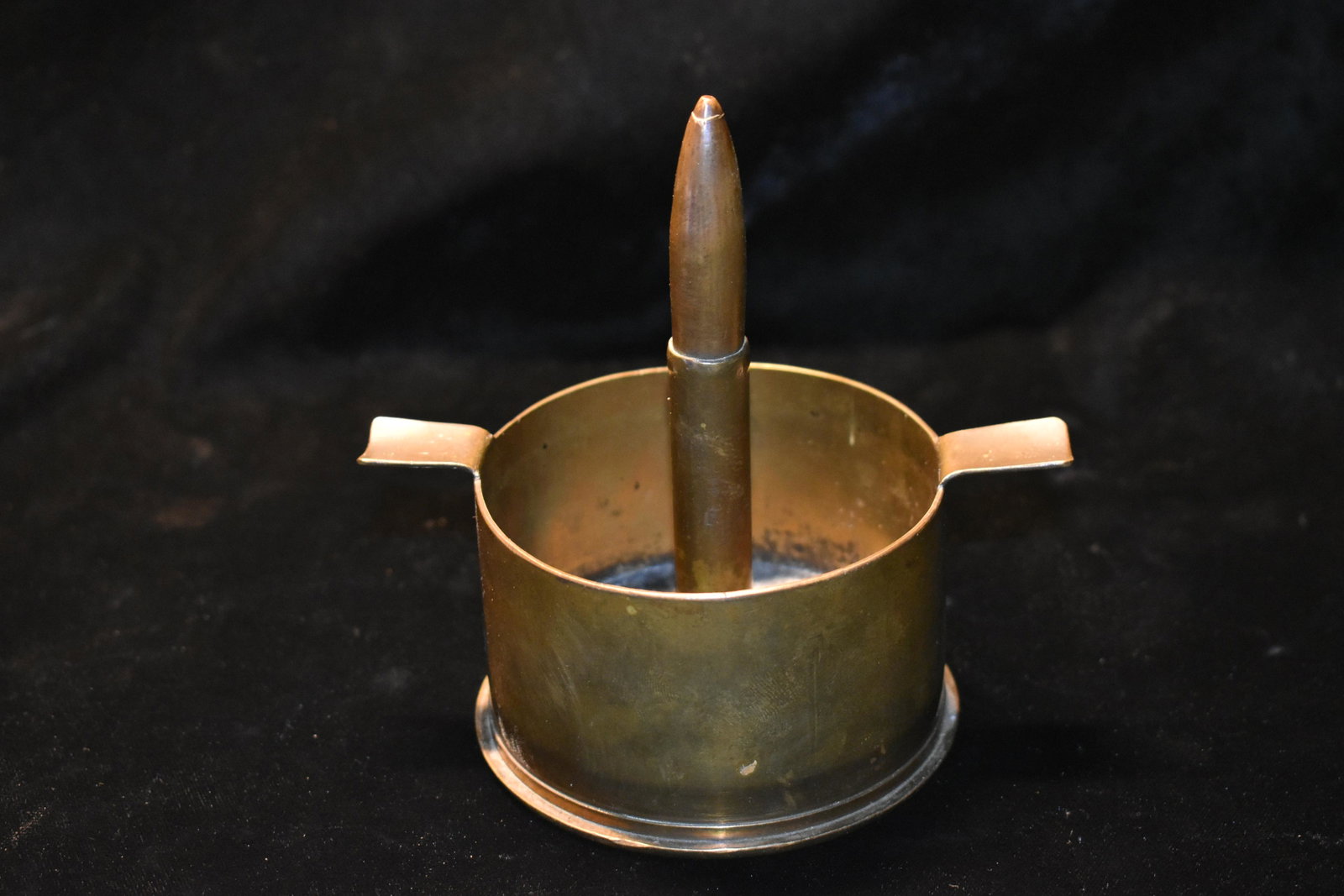 WW II Trench Art Ash Tray 1943: WW II Trench Art Bowl or Ash Tray. 1943 75MM M18 LOT C.B. & C. CO. 25. Center of Ash Tray is M131A2 round. Extremely well built with no damage.